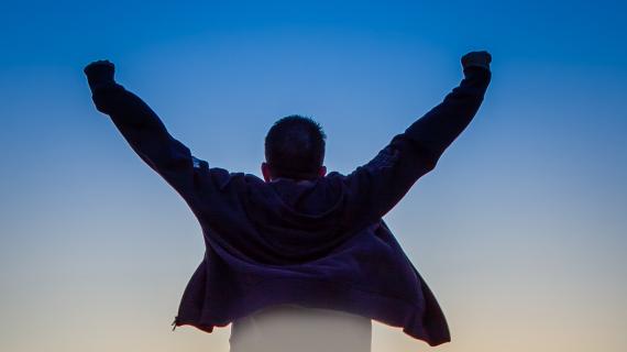 Man with hands stretched