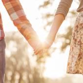 married couple holding hands
